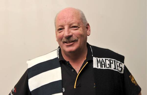 FOOT IN BOTH CAMPS: Ray Byrne with a Geelong and Collingwood scarf.   Picture: MATT KIMPTON