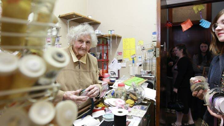 Cool under pressure ... 99-year-old Fay Morley serves her extra customers on Saturday, who could only fit in the tiny store one at a time. Picture: Jacky Ghossein.