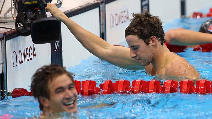 Came in second ... James Magnussen looks disappointed as Nathan Adrian celebrates.