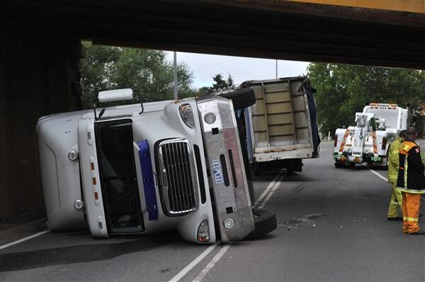 LOW BLOW: A truck driver escaped with minor injuries after hitting an overpass on the Midland Highway yesterday.