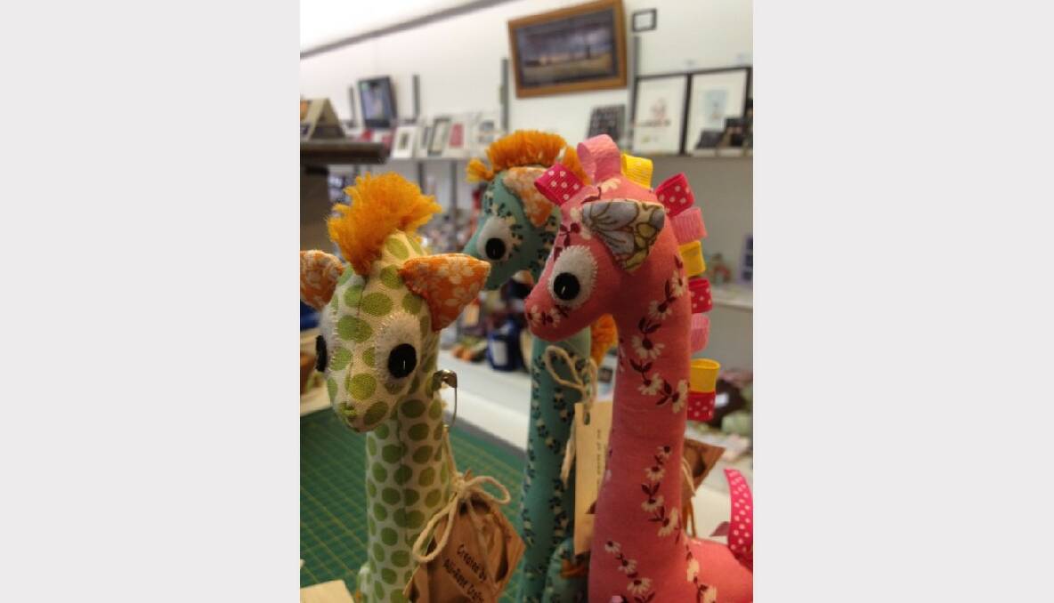 A Herd of Handmade giraffes @ View Point Handmade Gallery. By Jess