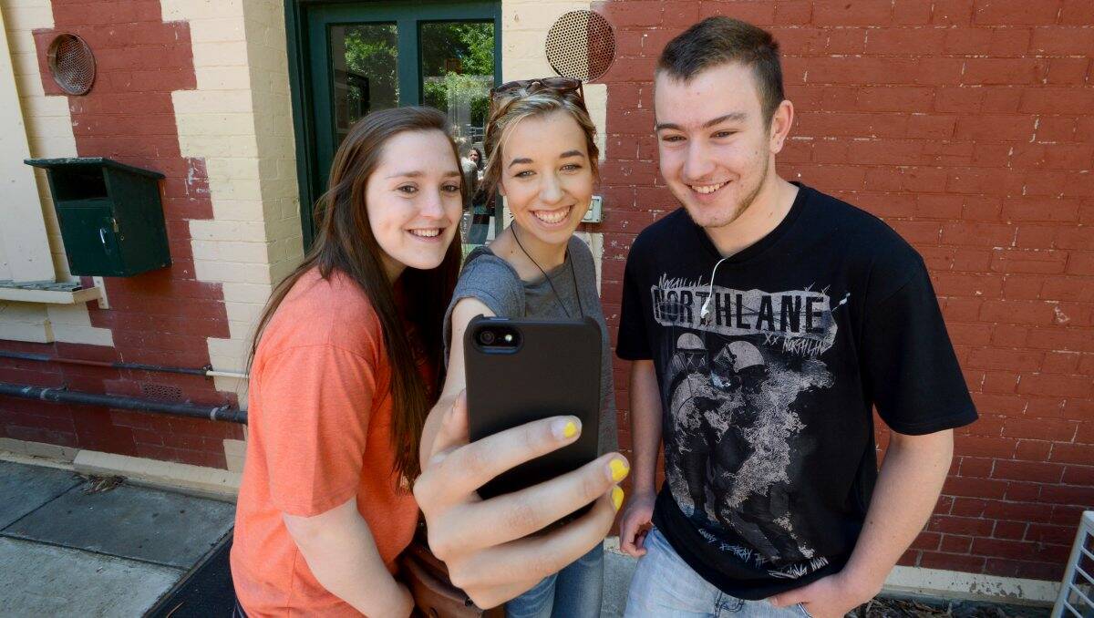 HOT OFF THE TEXT: Catholic College Bendigo students Katerina Hanzl, Aimee Staszkiewicz and Joel Atkinson got their scores via text yesterday. A special results liftout will appear in tomorrow’s Bendigo Advertiser.Picture: Jim Aldersey