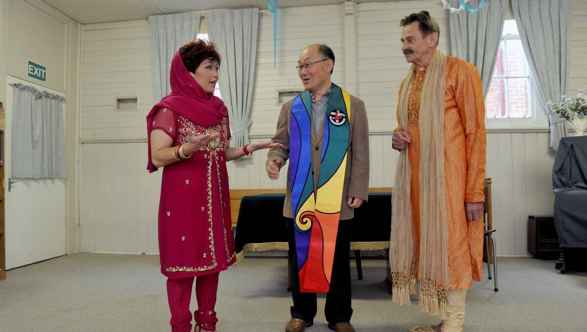 UNITED: Reverend Youn Kim, centre, with Etty and James Lerk. Picture: Julie Hough