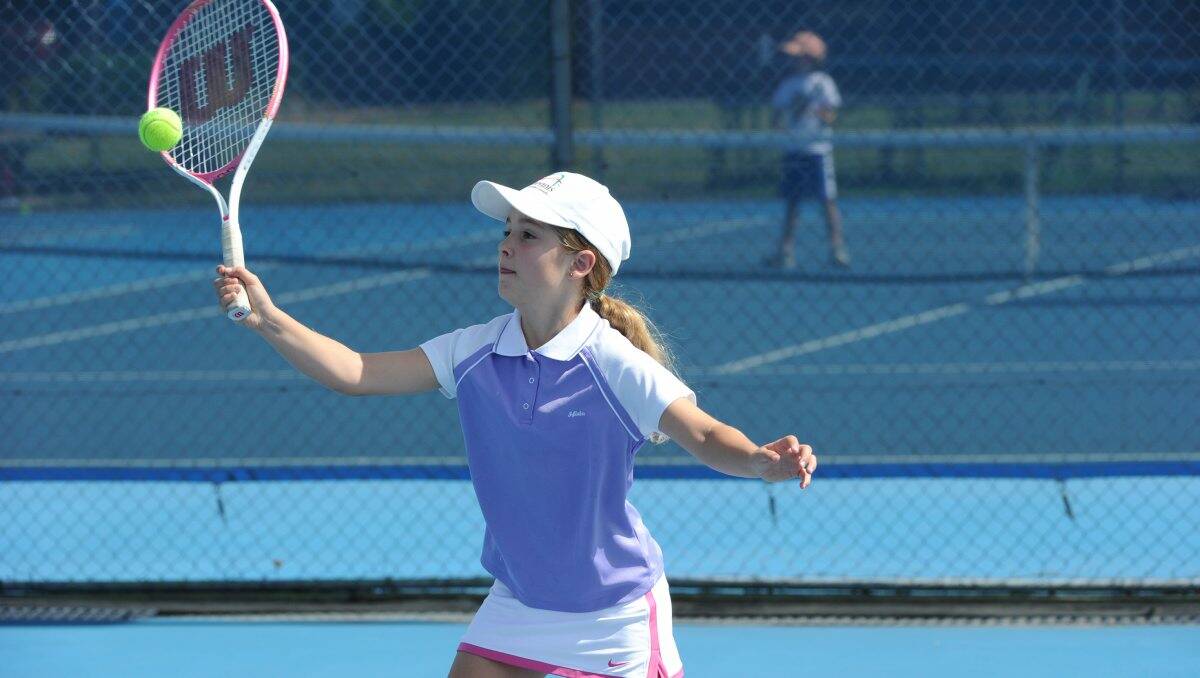 Competitive: Maddy McGrory from the South Bendigo team has a hit at the Nolan Street tennis complex. Picture: Peter Weaving