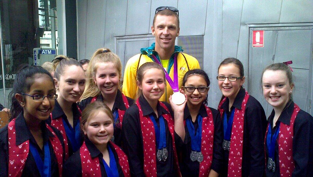 BIG DAY OUT: Members of the Bendigo Youth Choir with Australian rower and silver medallist Drew Ginn.   Picture: CONTRIBUTED