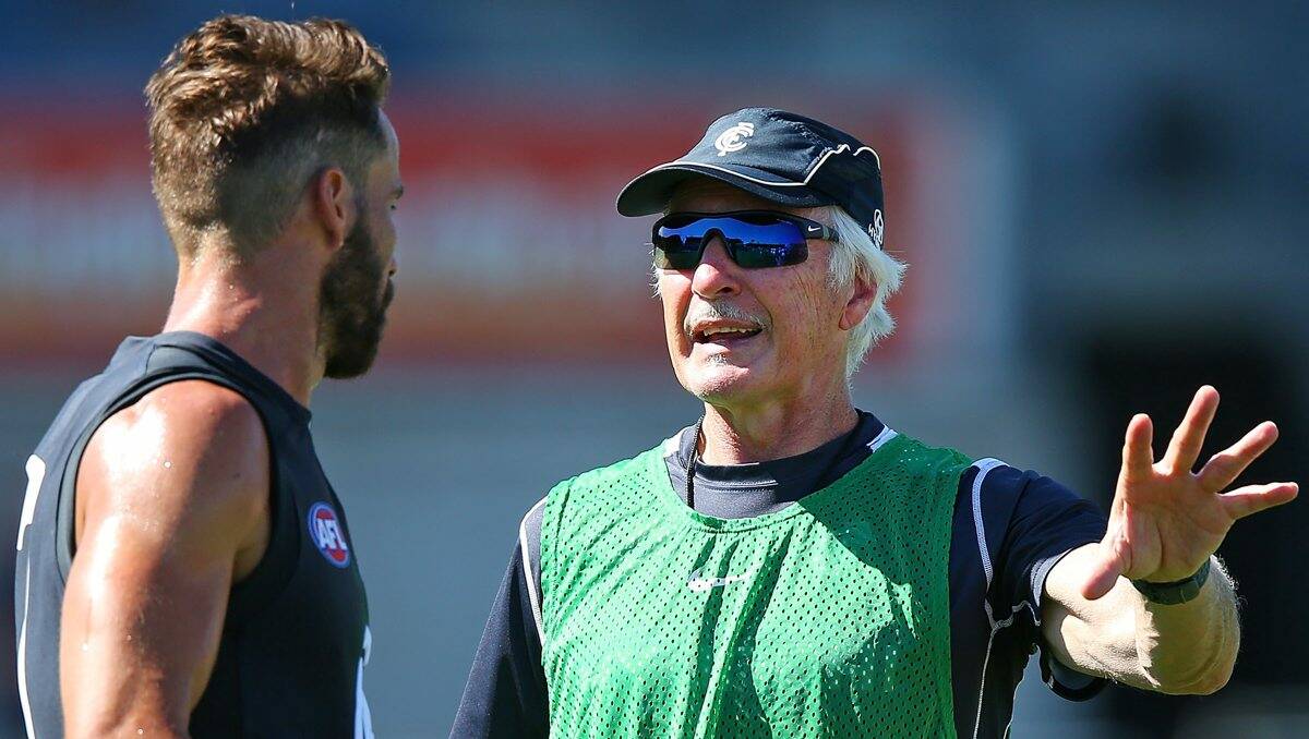 ALL EARS: Andrew Walker listens to coach Mick Malthouse. Picture: GETTY IMAGES 