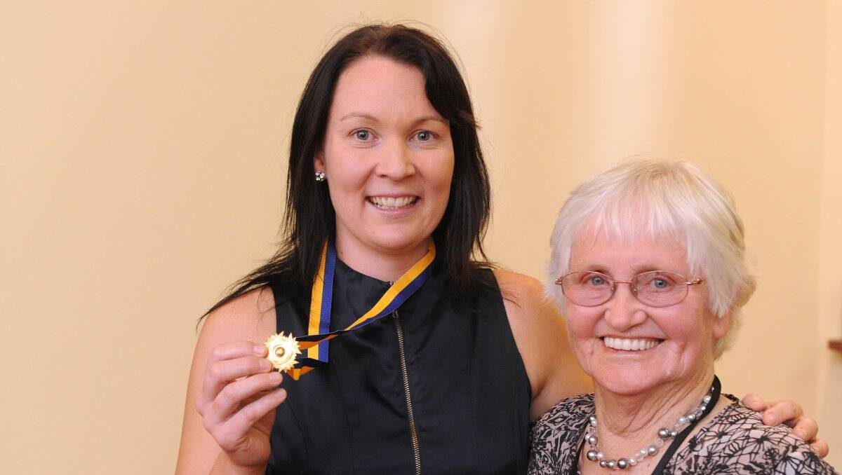 PROUD MOMENT: Karly Bingham, the A-grade netball best and fairest, and Betty Thompson. Picture: PETER WEAVING