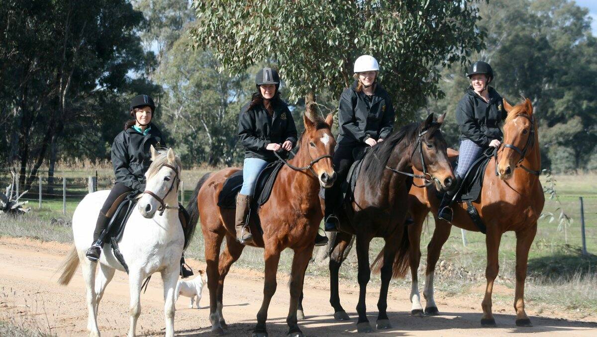 EADY TO RIDE: Pictured from left, Judi Ludeman on Star, Leanne Taig on Archie, Kristy Arnold on Occy and Kylie Morrison riding Whorl, preparing for the Horse Ride for Cancer. Picture: CONTRIBUTED