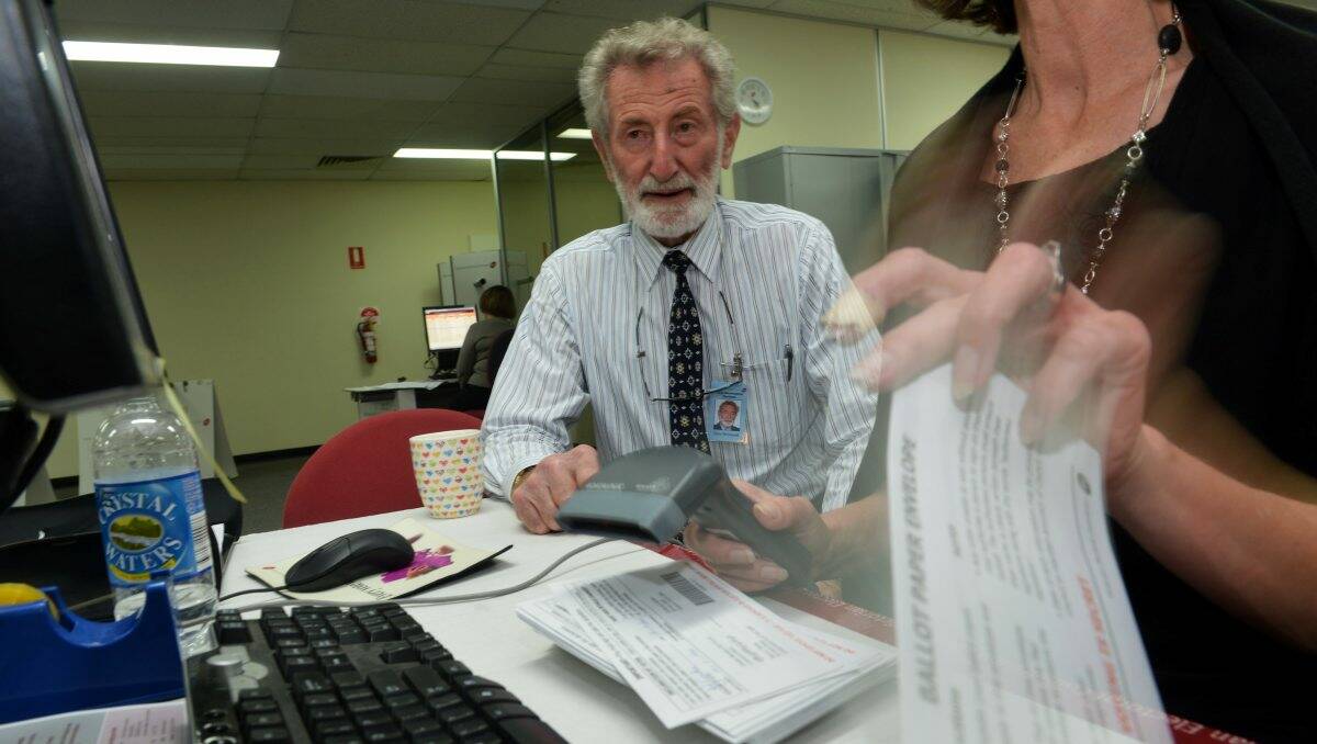 Thorough: Tony McDowell goes through ballot cards. Picture: BRENDAN McCARTHY
