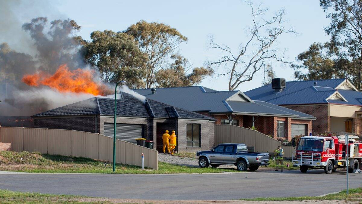 BLAZE: CFA crews battle the fire. Picture: LIZ KEEN
