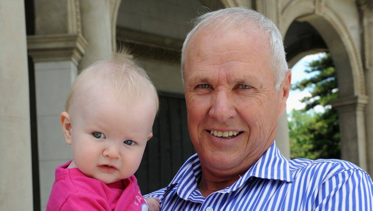 GLOBE TROTTER: Greg Westhead reflects on his army days. Right – With his granddaughter, Kennedy.