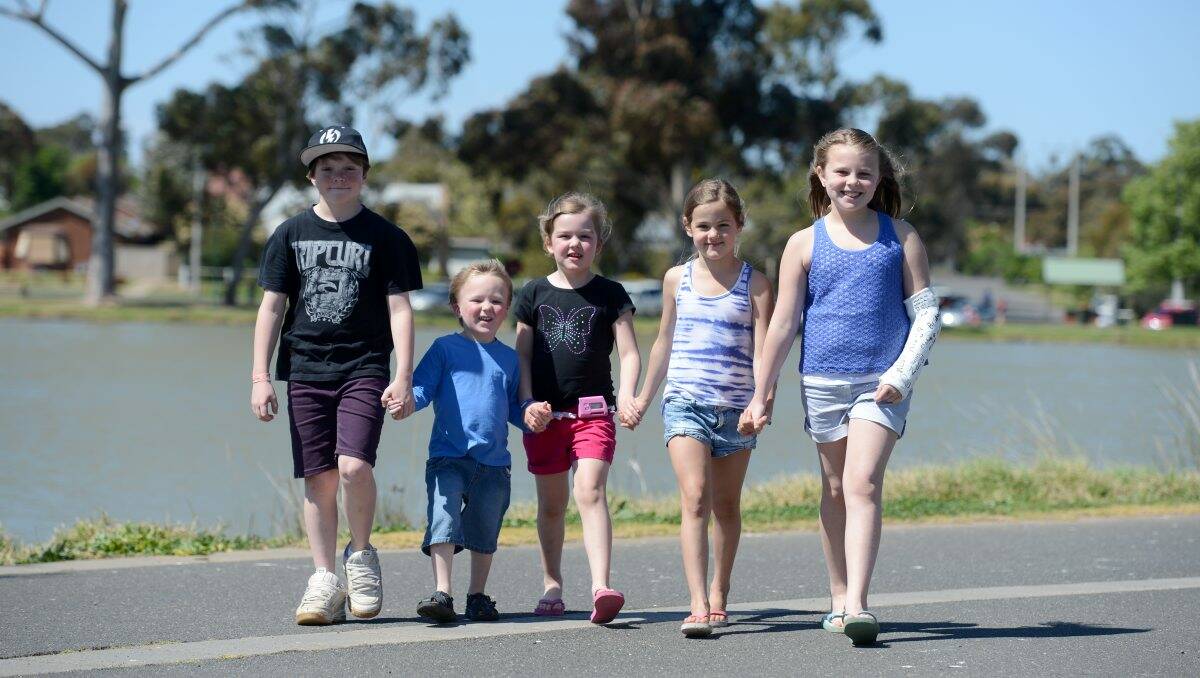 Helping hand: Blair Boyd, 10, Cooper Scholes, 3, Caitlin Crute, 6, Bridget Johns, 8, and Imogen Yeates,10 all have type 1 diabetes. Picture: Jim Aldersey