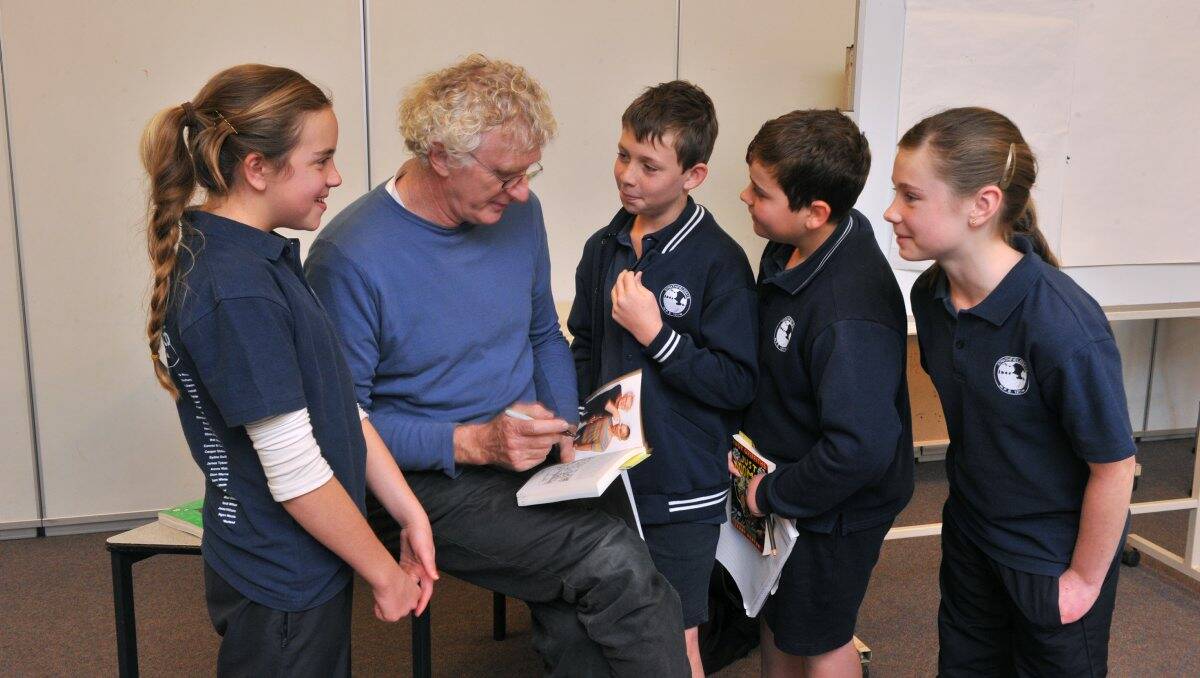 a welcome guest: Author and illustrator Terry Denton visits Strathfieldsaye Primary School, where students Zahlia Burrill-Grinton,  Jed Rodda, Seamus Dwyer and Sophie Keating get their book signed by the author. Picture: Peter Weaving