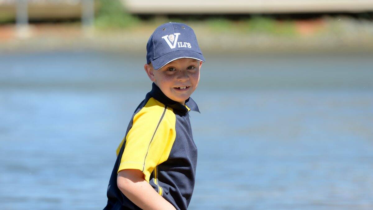 Sunny: Edward Nicholas, 8, cools off at the field days yesterday.