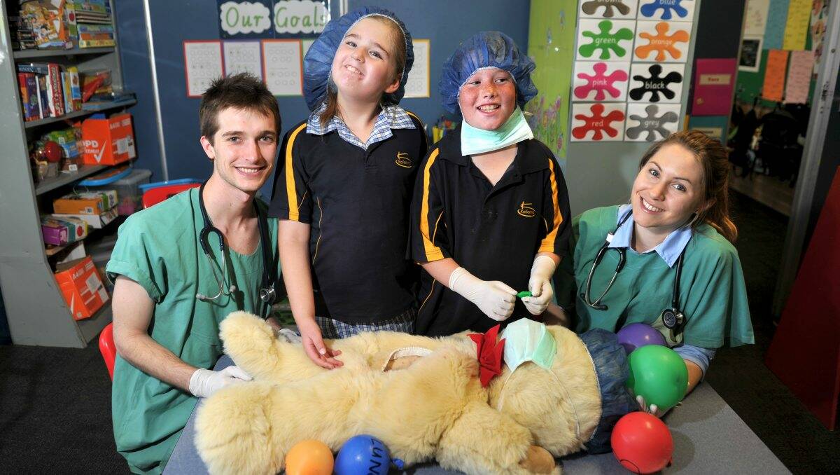 DOCTORS FOR A DAY: Monash University medical students Nat Dentry and Rebecca Suhr yesterday tought Kalianna Special School students Sophia and Dylan about medical procedures. Picture: JODIE DONNELLAN