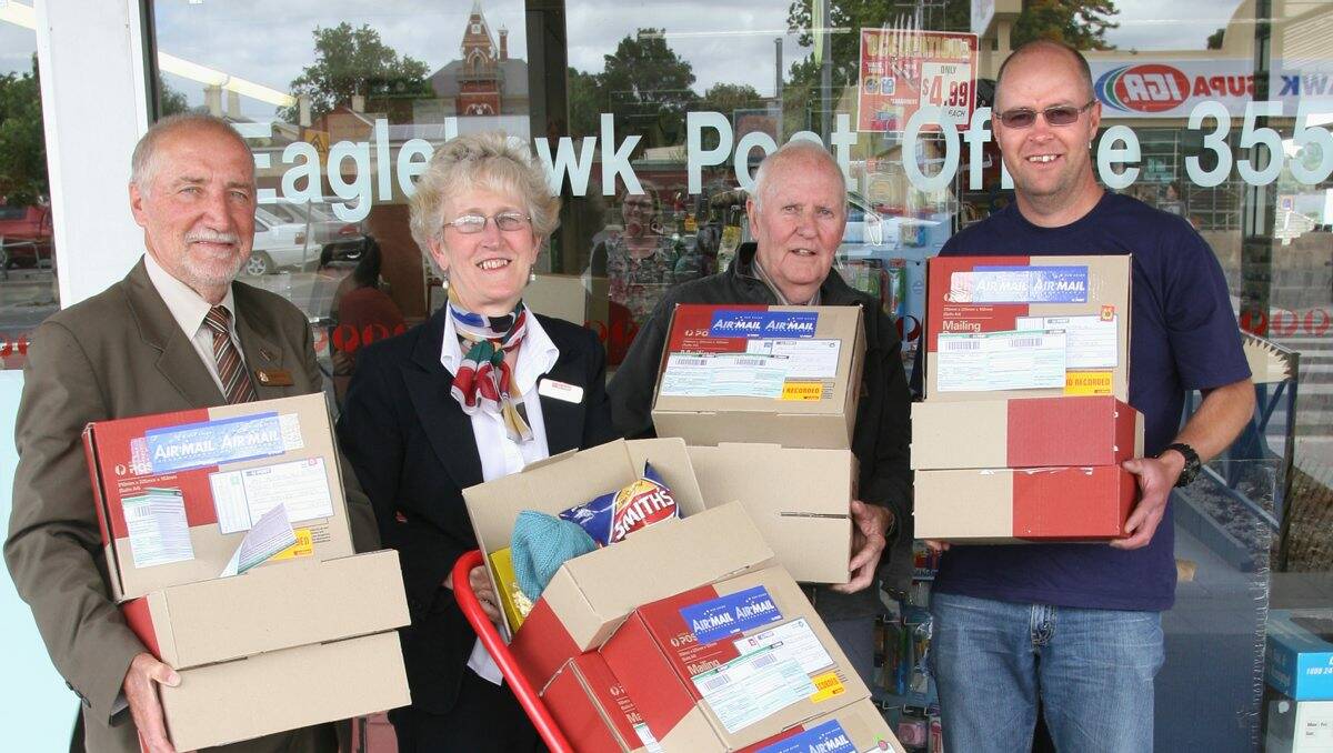 GIVING: Paul Penno, Ardina Davis, Bob Harrison and Grant Thompson with goods to be distributed to troops serving overseas. Picture: Peter Weaving