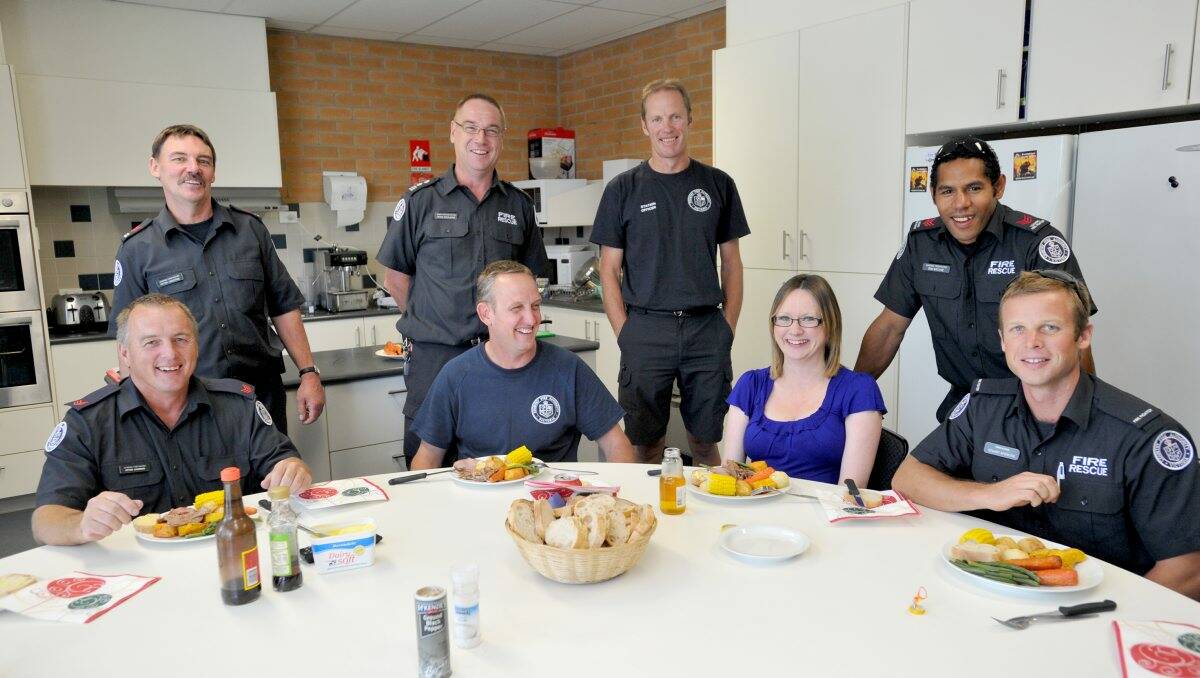 LUNCH ON THE JOB: Bendigo Fire Brigade members and their families had Christmas lunch at the station. Picture: JODIE DONNELLAN