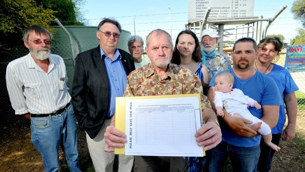 PUSH: Jim McCarthy, Andrew Penna, Ken Hamilton, Tony Dillion, Bill Collier, Linda and Shane Howell with 5-month-old Emily and Michelle Jones are all part of the Save the Golden Square Swimming Pool group. Picture: JODIE DONNELLAN
