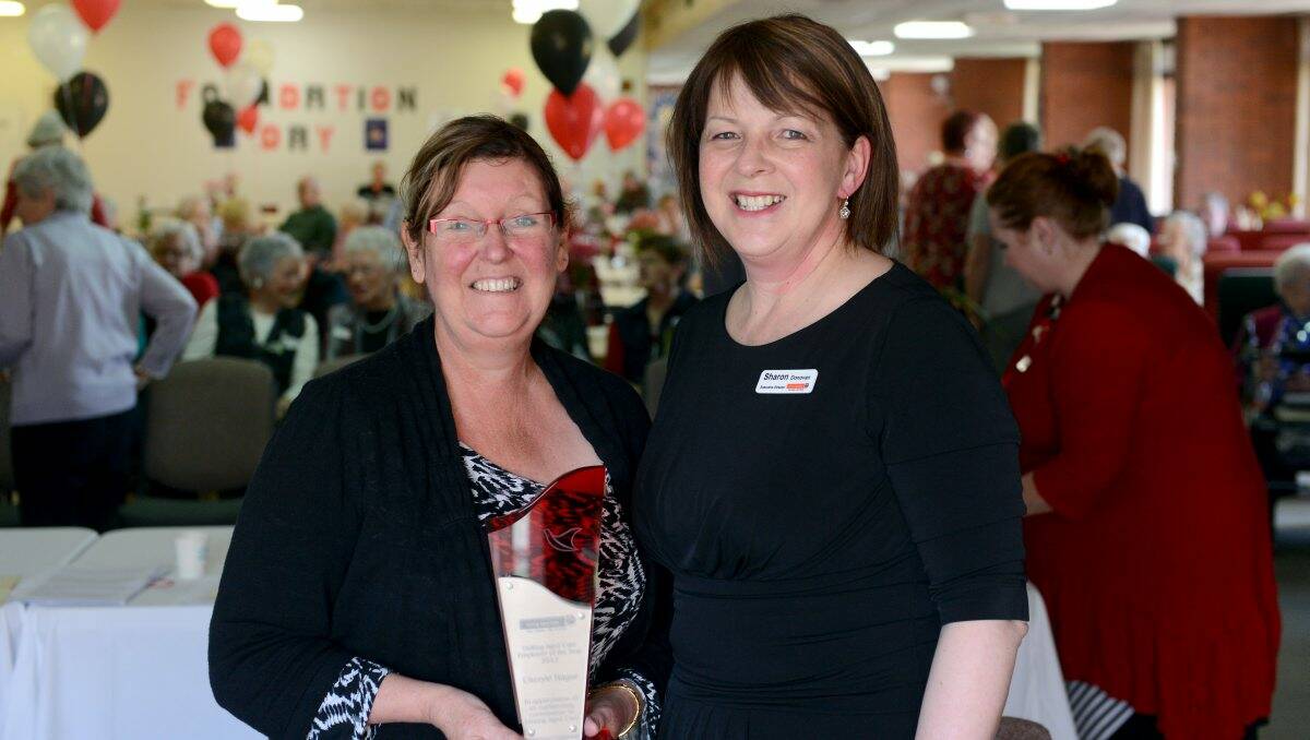AWARD: Cheryle Hague is congratulated by Uniting Care executive director Sharon Donovan for her work at Strath Haven. Picture: JIM ALDERSEY