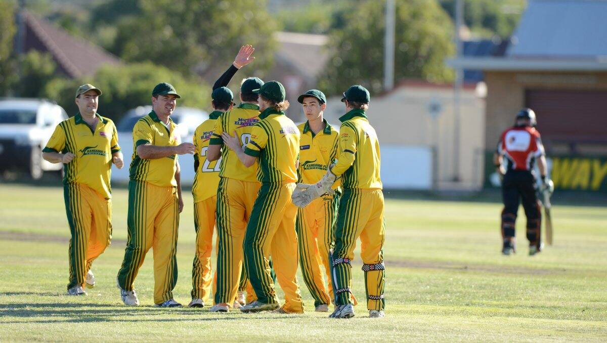 Kangaroo Flat players celebrate a wicket.