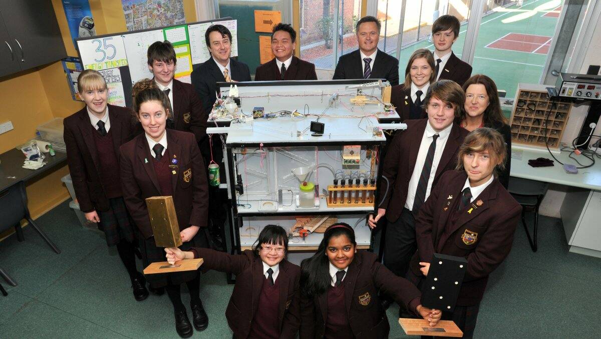 Success: Girton Grammar School principal Matthew Maruff, back second from right, with staff members and students involved in the spaghetti machine project.