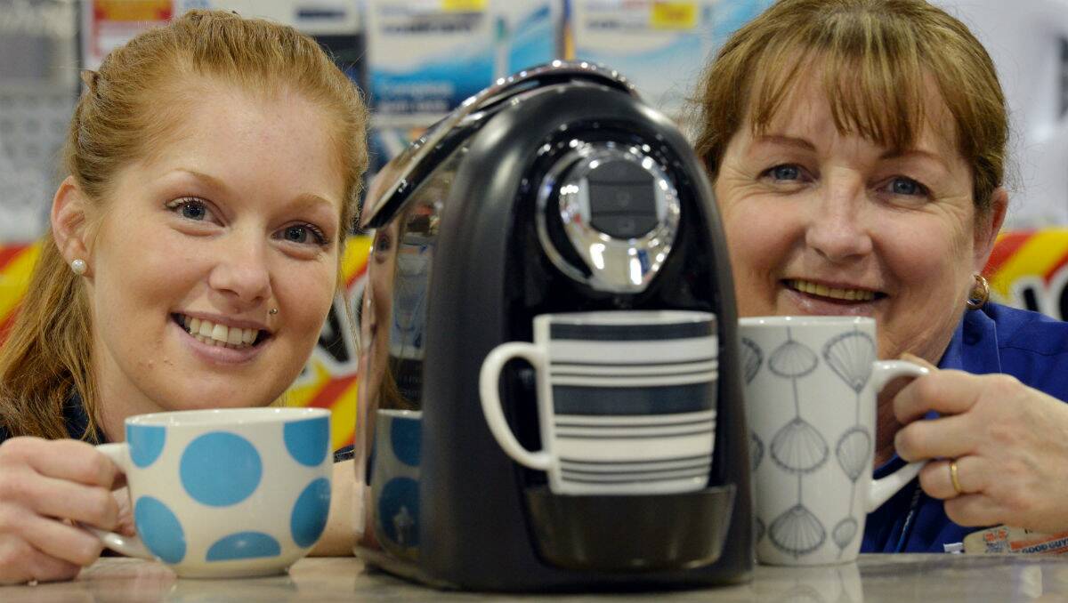 PRIZE: Amy Fowler and Maureen Anstee try out the coffee machine that’s up for grabs.