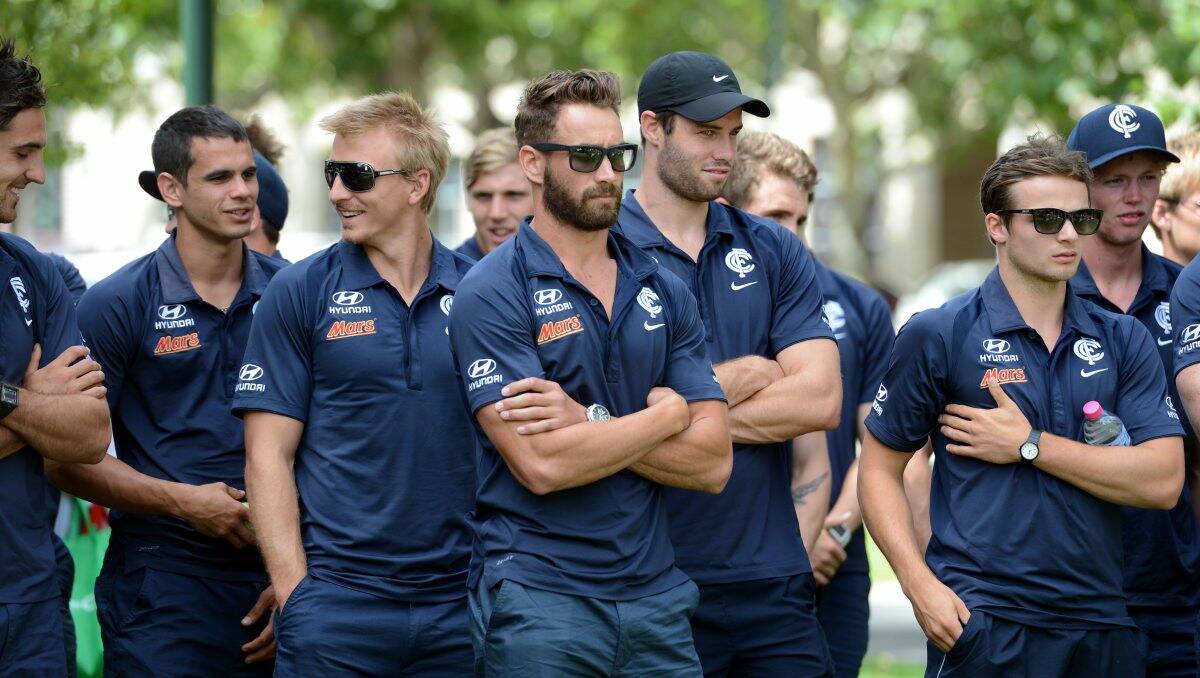 Andrew Walker and team-mates in the Bendigo Civic Gardens on day one of the community camp.