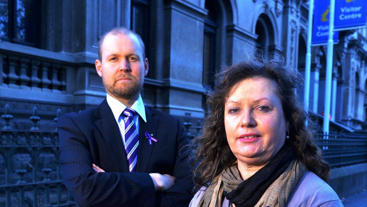  Loddon Campaspe Community Legal Centre’s Peter Noble and Elaine Harrington outside the Bendigo Post Office, which will turn purple over the weekend. Picture: Brendan McCarthy