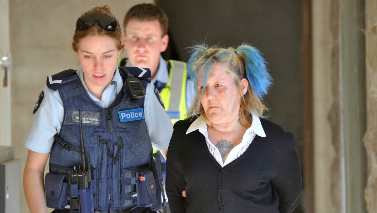 ‘TRAGEDY’: Veronica Hudson is led from court. Picture: Jodie Donnellan