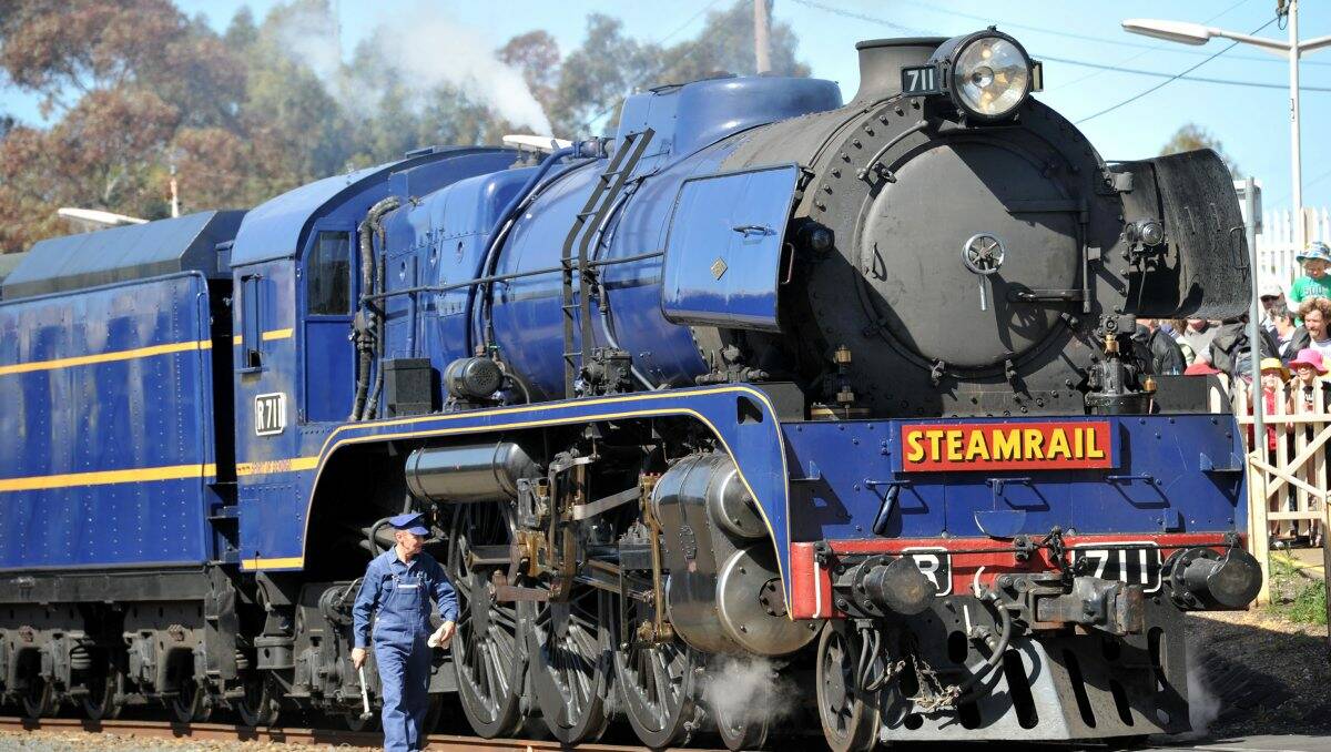 DEJA VU: One-hundred-and-fifty years after the first steam train was welcomed into Bendigo, the city’s own R711 rolled into the station yesterday to fanfare, rifle fire and a crowd of thousands. Picture: JULIE HOUGH