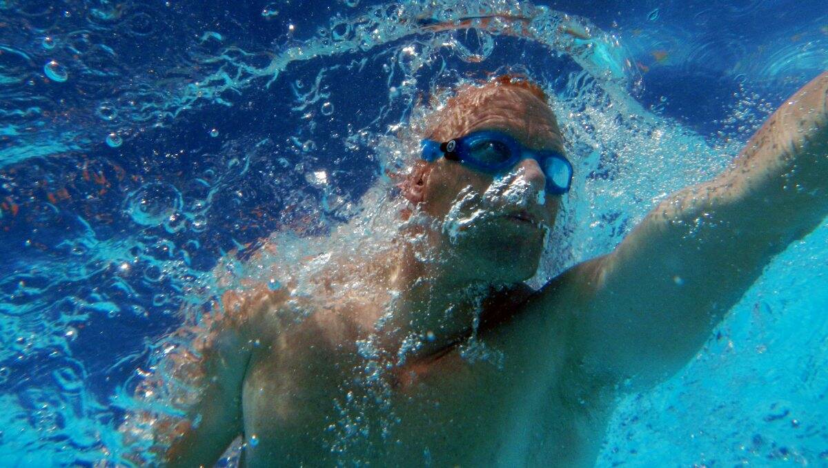 Nick Gates powers through the water as he swims laps at the aquatic centre. Picture: BRENDAN McCARTHY