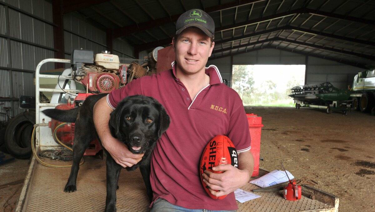COUNTRY LAD: Grant Weeks at home on his family farm at Colbinabbin this week with his dog, Max. Picture: JODIE DONNELLAN