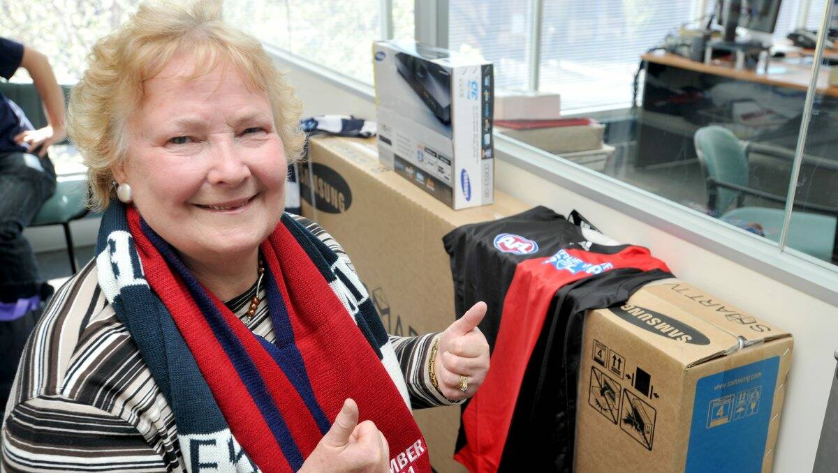 all smiles: Bendigo Advertiser footy tips winner Kaye Trimble with her prizes. Picture: Jodie Donnellan