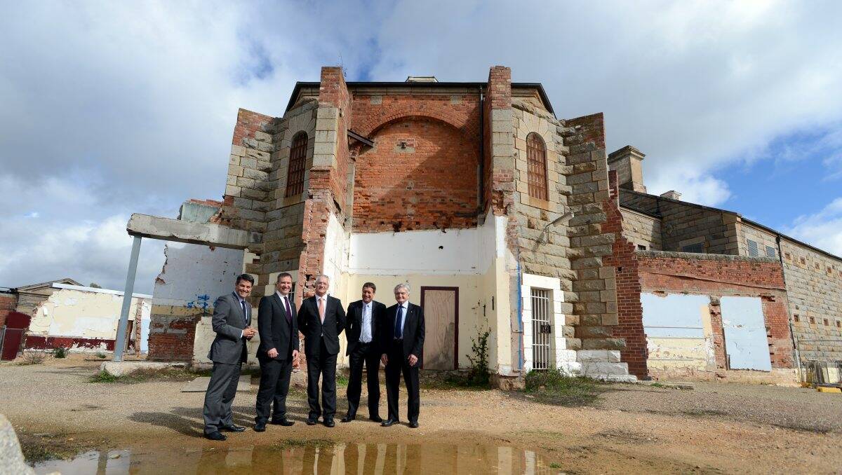 GOING AHEAD: Director of city futures Stan Liacos, CoGB CEO Craig Niemann, member for northern Victoria Damian Drum, BSSC principal Dale Pearce and mayor Alec Sandner at the state government’s announcement yesterday that it has given the green light to the Old Bendigo Gaol theatre.  Picture: JIM ALDERSEY