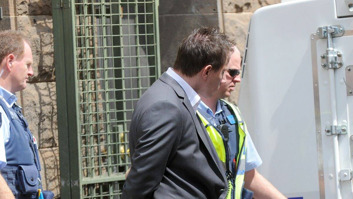 GUILTY PLEA: Brett Pettersen is led from court in Bendigo yesterday after being sentenced to 18 months in prison.