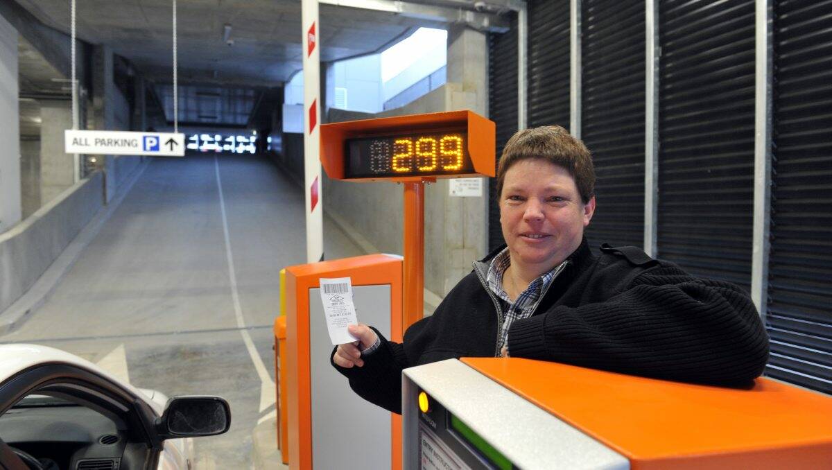 CONVENIENT: Heathcote’s Rosemary Hill proudly displays her ticket to the new Edward Street car park, the first to be issued after it was opened to the public at 7am yesterday.