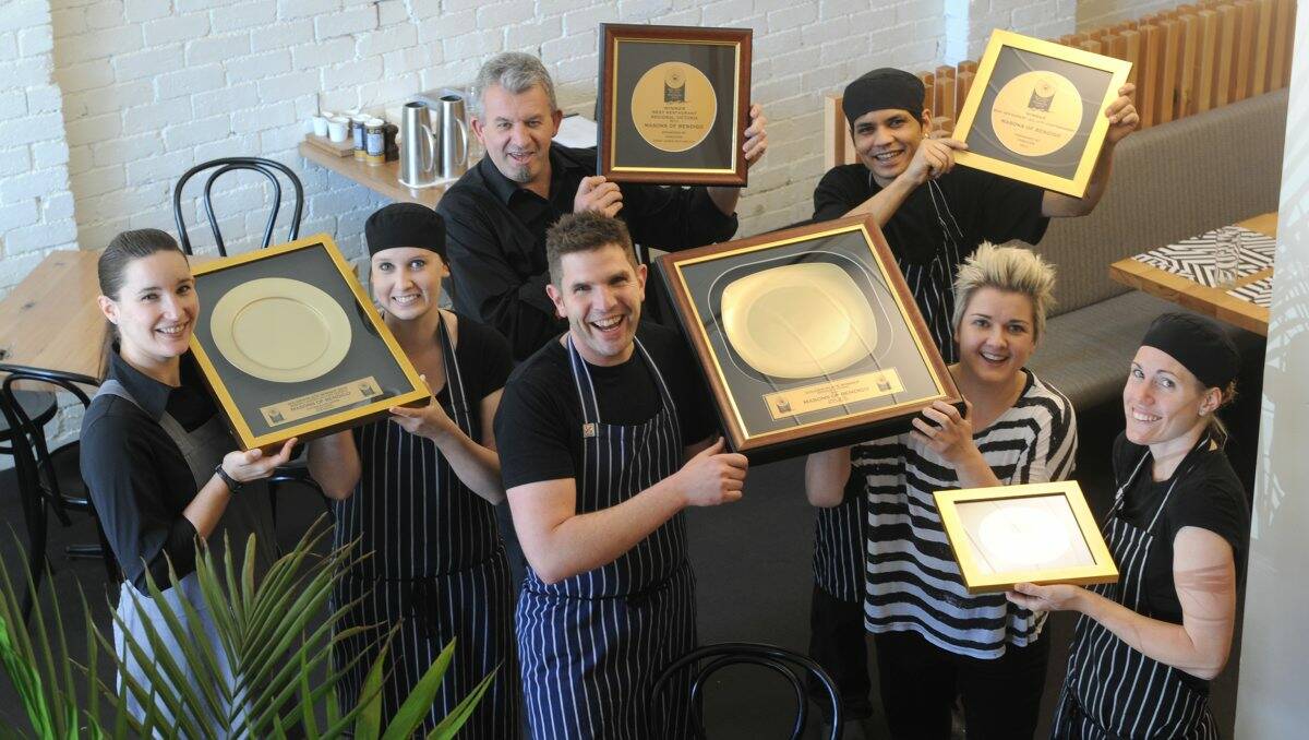 ECSTATIC: Masons of Bendigo staff Ginnie Sala, Steph Lloyd, Nick Clarke, Sunil Thapa and Gemma Cumming celebrate their Golden Plate awards win with restaurant owners Nick and Sonia Anthony. Picture: Peter Weaving