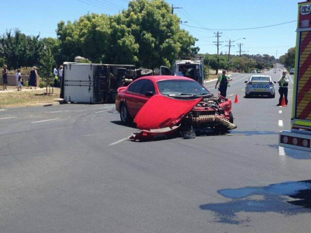 CRASH SCENE: Police and emergency services attend the crash in Kangaroo Flat. Picture: JODIE DONNELLAN