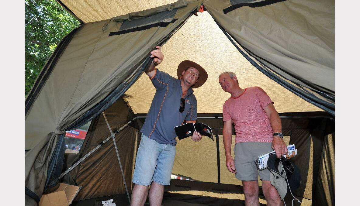 Darren Grossman from Oz Tents in Harrietville shows Bendigo's Jeff Torpy through one of his tents. 
