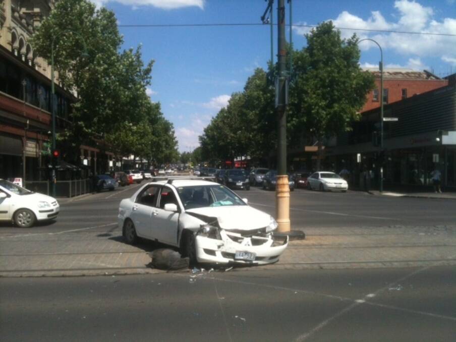 A car is stranded in the middle of Pall Mall this afternoon.