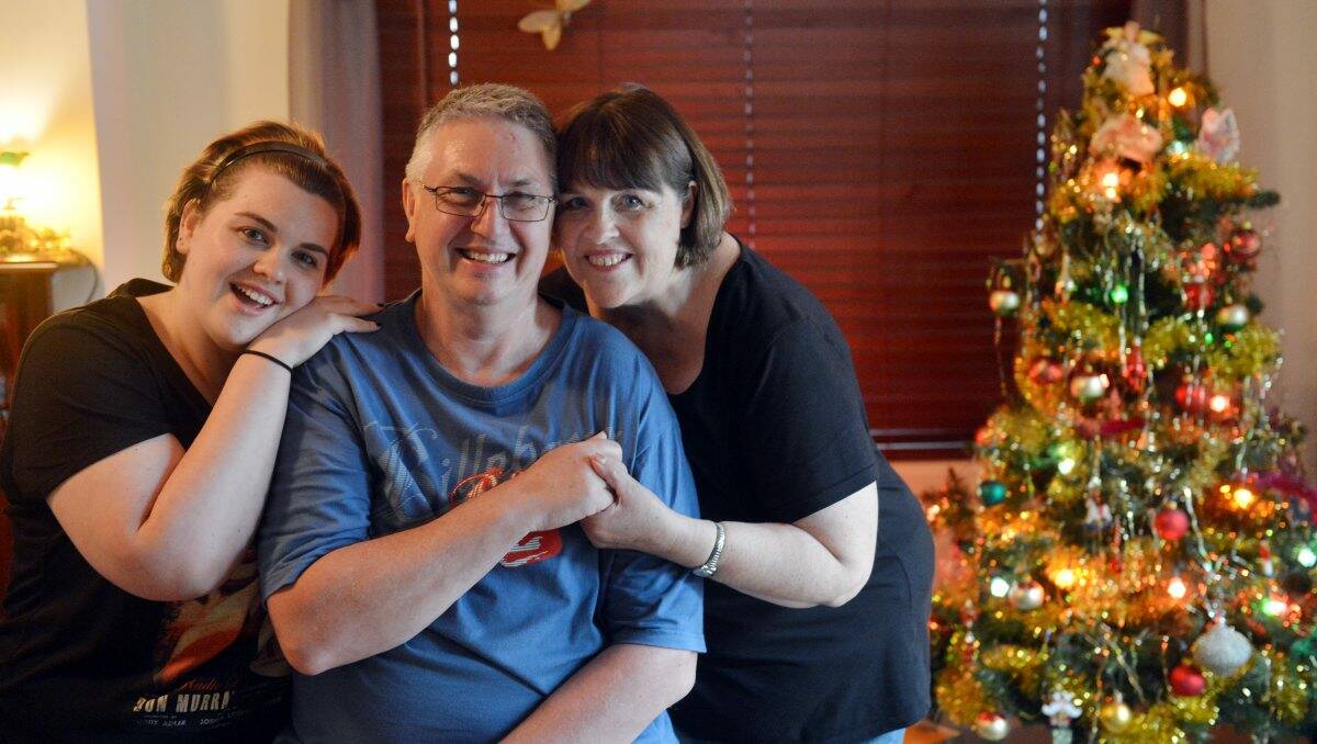 HOME AT CHRISTMAS: David Buchanan with his daughter Lucy and wife Rhonda. 