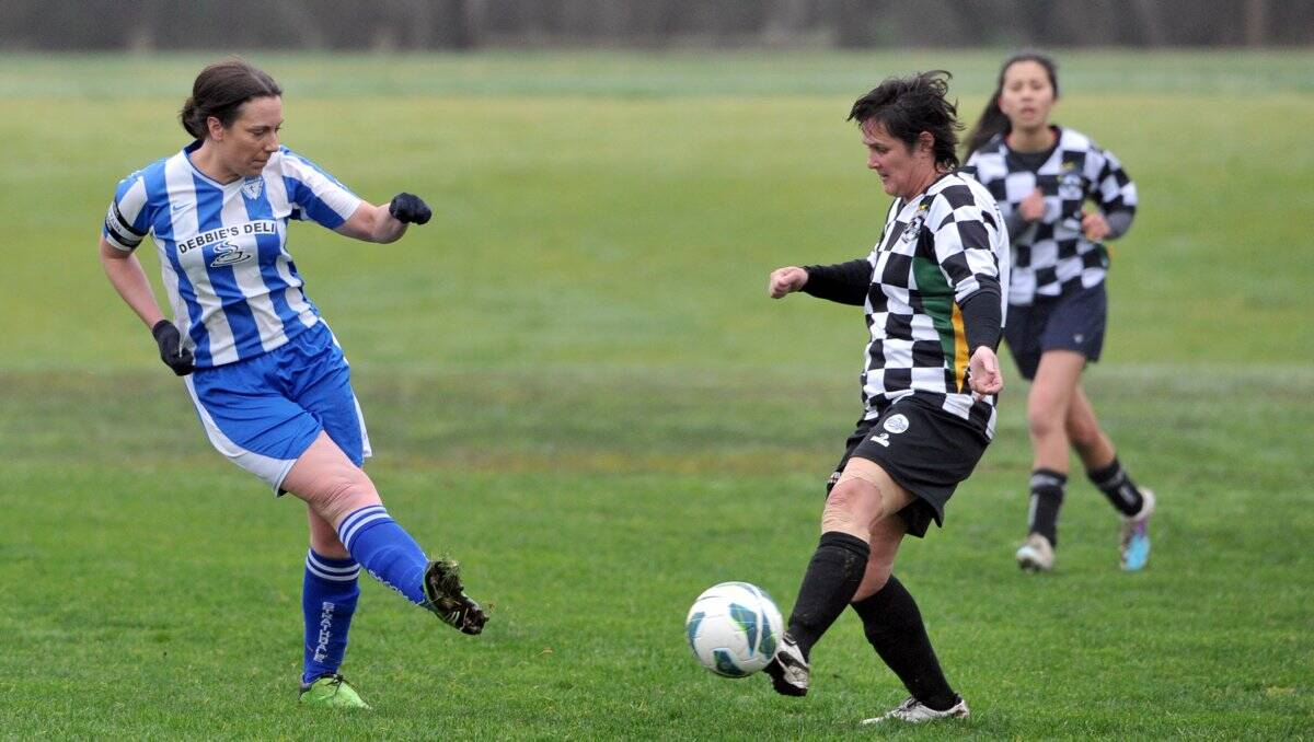 FOOT SKILLS: Strathdale captain Rachel Oper and Castlemaine’s Lyn West battle for the ball in Sunday’s clash at Beischer Park. Picture: JULIE HOUGH