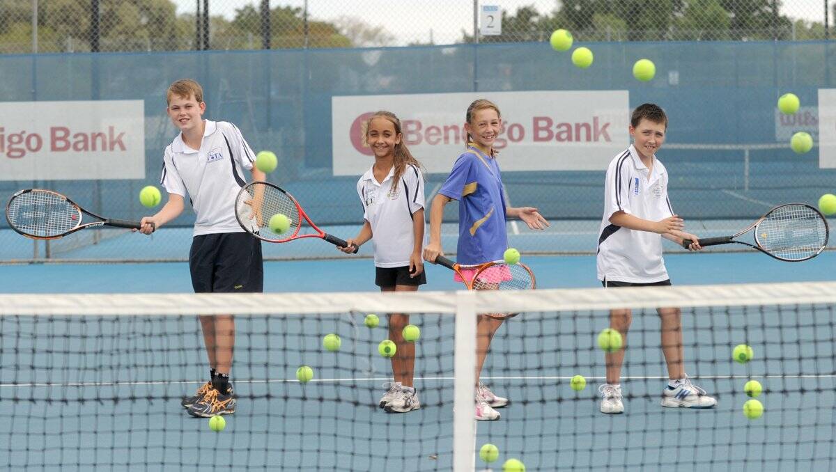 RALLYING ON: Harry Everist, Tiahna Leader, Sally Warren and Jack Cripps practise their volleying skills on the eve of the regional talent development camp being run at the Bendigo Bank tennis complex. Picture: JODIE DONNELLAN 