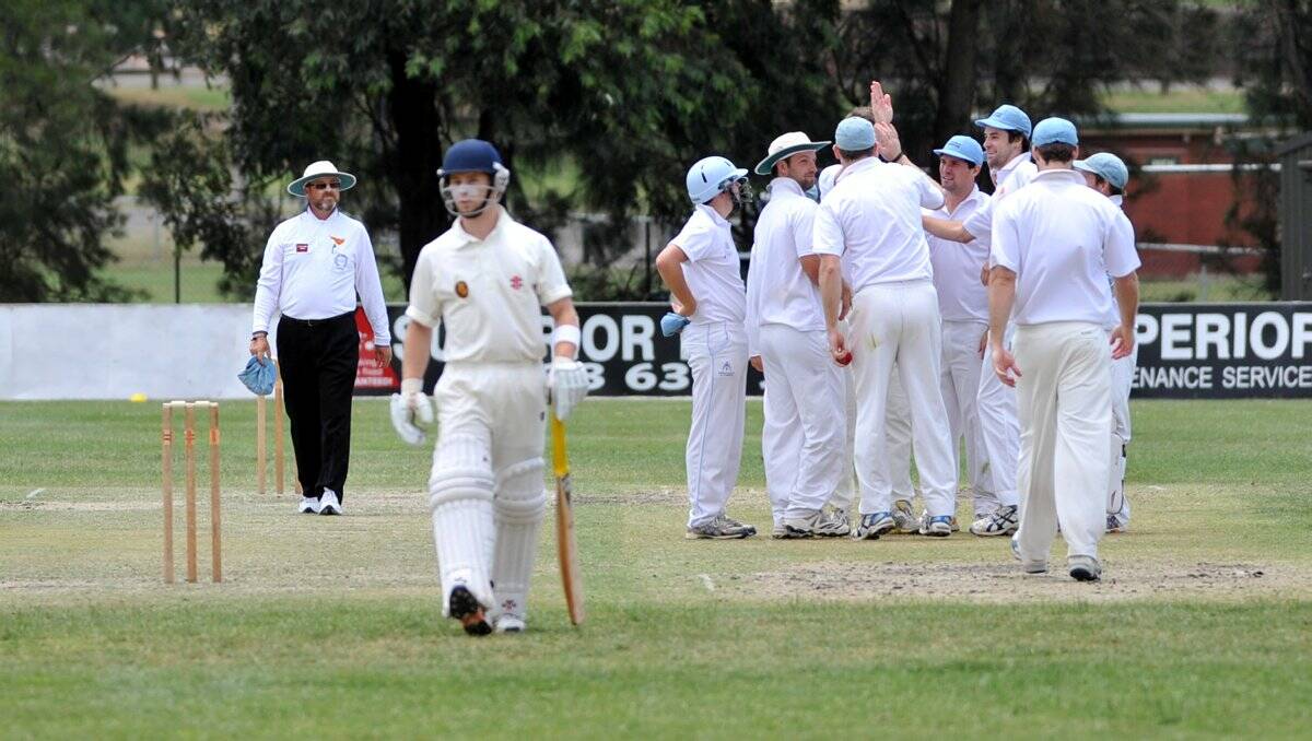 long walk back: Strathdale-Maristians celebrate the wicket of Bendigo’s Damian Wust for seven on Saturday. It was one of 20 wickets the Suns captured in a dominant performance. Picture: JULIE HOUGH 