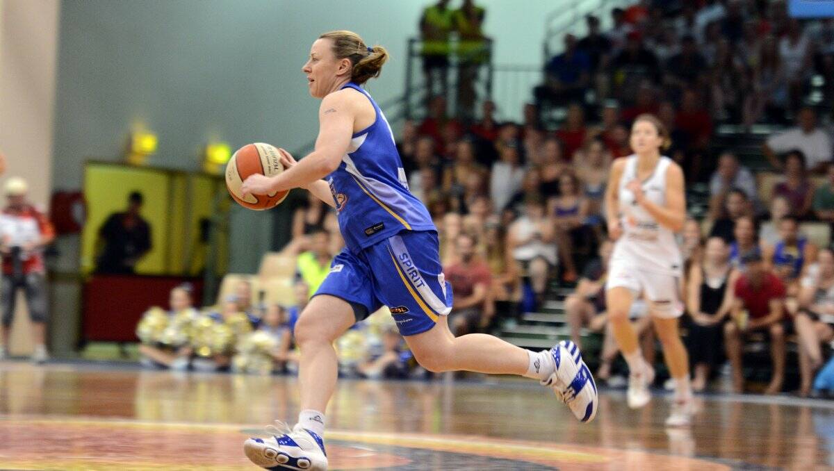 LEGEND: Bendigo Spirit guard Kristi Harrower charges down the court in Sunday's WNBL grand final victory against Townsville Fire. Picture: JULIE HOUGH 