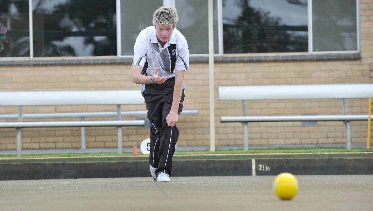 GREAT FORM: Victorian representative Brad Marron, who won bronze in the triples at the national under-18 lawn bowls titles, bowls at Bendigo East. Picture: JODIE DONNELLAN