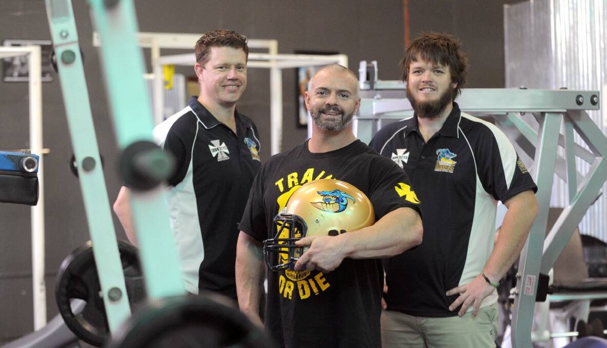 JOINING FORCES: Bendigo Dragons treasurer Dennis Barnett, Doherty’s Gym manager Danny McQuinn and Dragons captain Dave Barker are eagerly awaiting the start of the Gridiron Victoria season. Picture JODIE DONNELLAN 