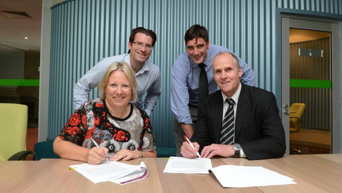 DEAL STRUCK:  Workspace Australia CEO Rebecca Dempsey, Central Victoria Australian Football Commission chief Greg Westbrook, CoGB Active and Healthy Communities manager Pat Jess,  and CVAFC  chairman Col Brady signing the lease on the new sports hub. Picture: JIM ALDERSEY
