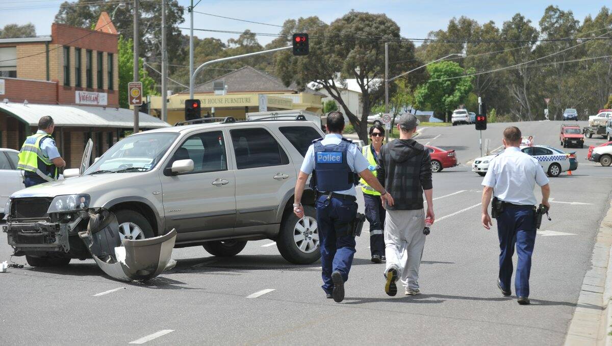 Police at the scene of the crash near the Aldi supermarket in Kangaroo Flat. 