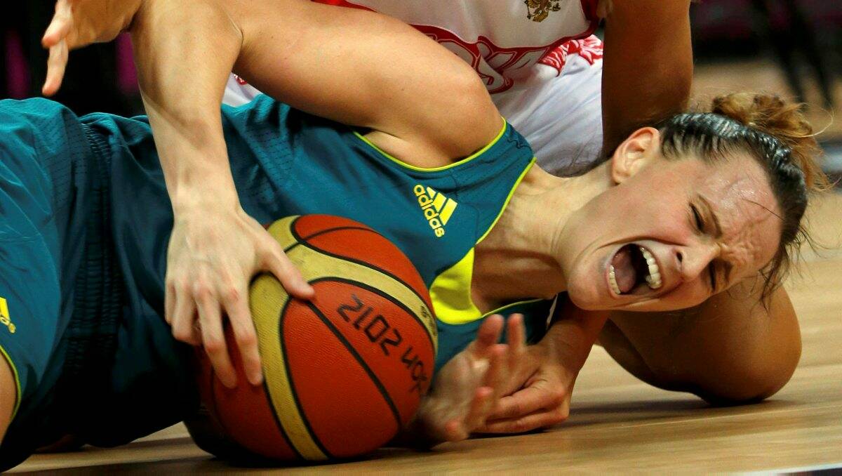 CONTEST: Australian Opal Jennifer Screen competes for the ball on the floor. Picture: REUTERS
